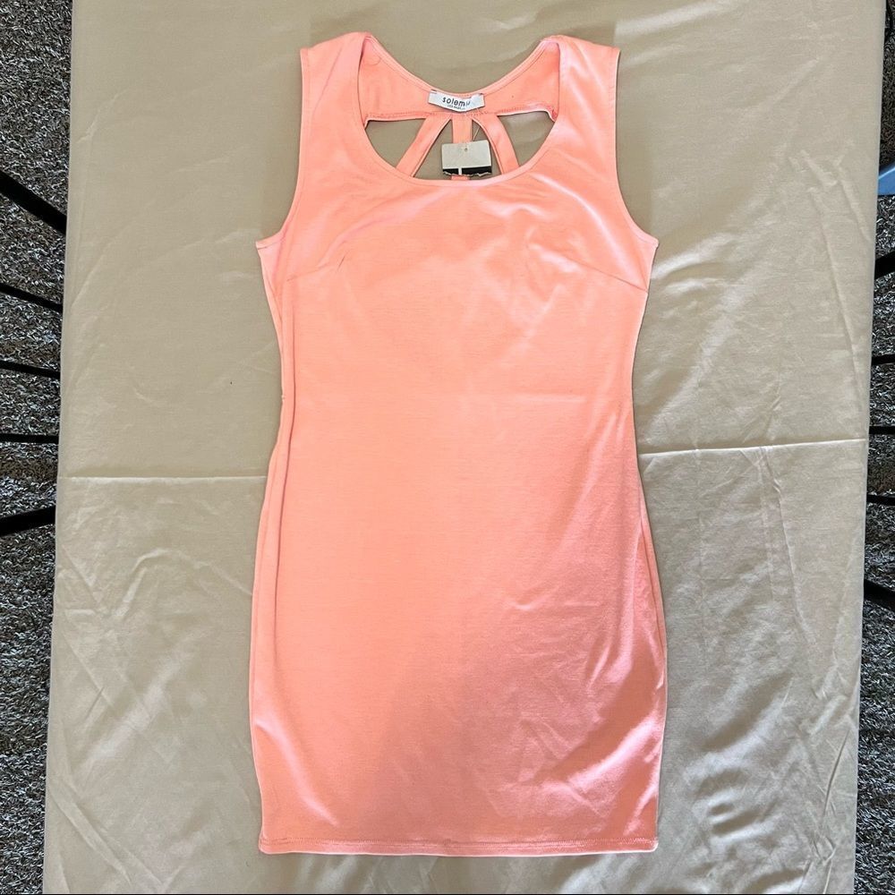 Solemio peach color dress in a size medium.